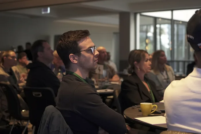 Members listening closely during a session at the members only day