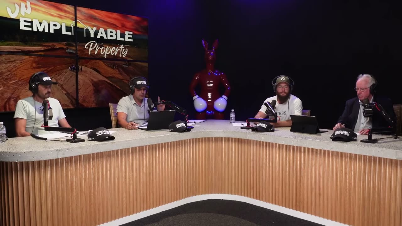 The Unemployable hosts recording in the podcast studio