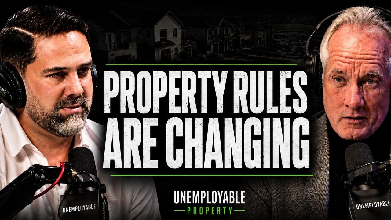 The New Planning Rules That Could Change Gold Coast Property - a dark-haired host in headphones facing a grey-haired guest across studio microphones, a row of townhouses behind them, under the overlay text Property Rules Are Changing.